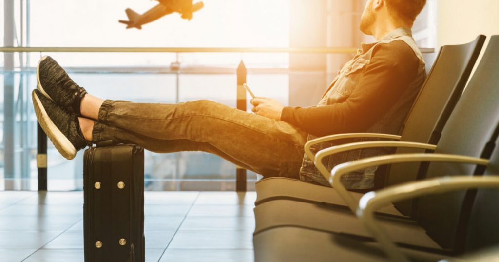 Man waiting in a seat at the airport