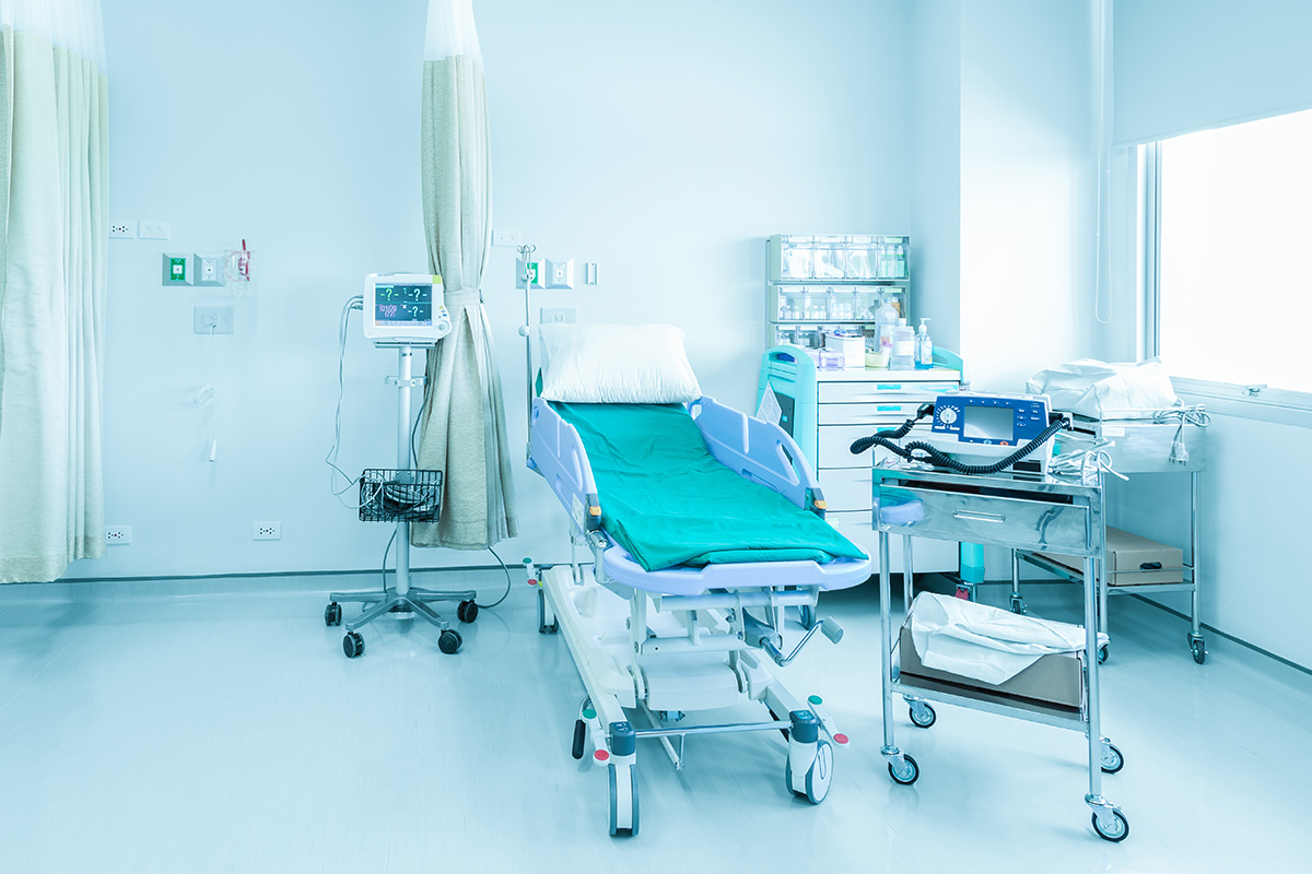 Empty hospital bed in a empty hospital room